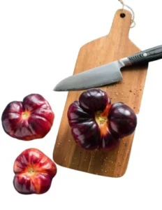 knife with chopping board and veggies